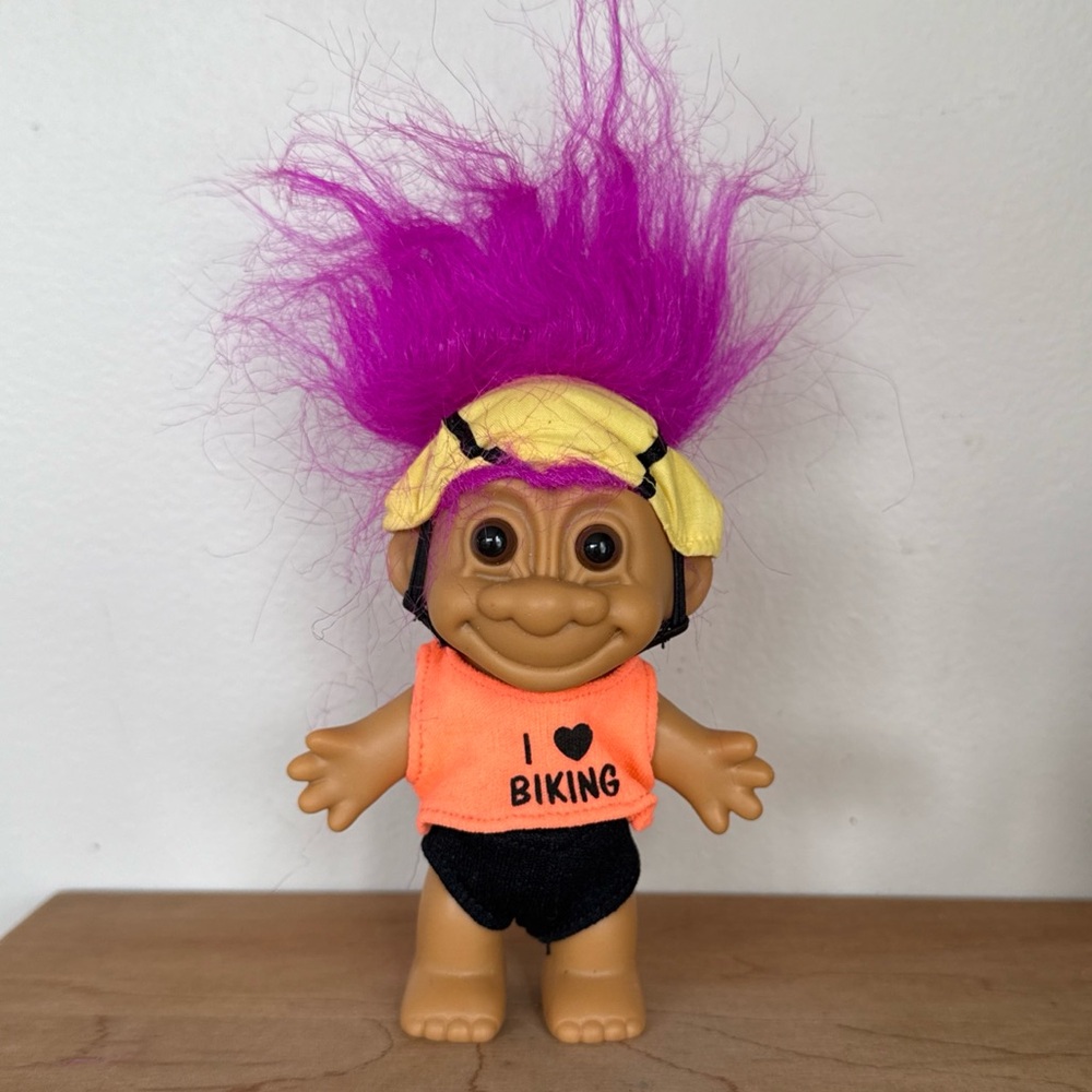 Vintage 1990s cycling Russ Troll Doll with Purple Hair and Orange Shirt
